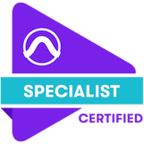 Purple Triangular logo with a teal ribbon on top. Inside the rectangular teal ribbon is the word "Specialist" in all white capitalized font. Underneath the word "Specialist", next to the triangular logo, is the word "Certified" in purple and all caps. The